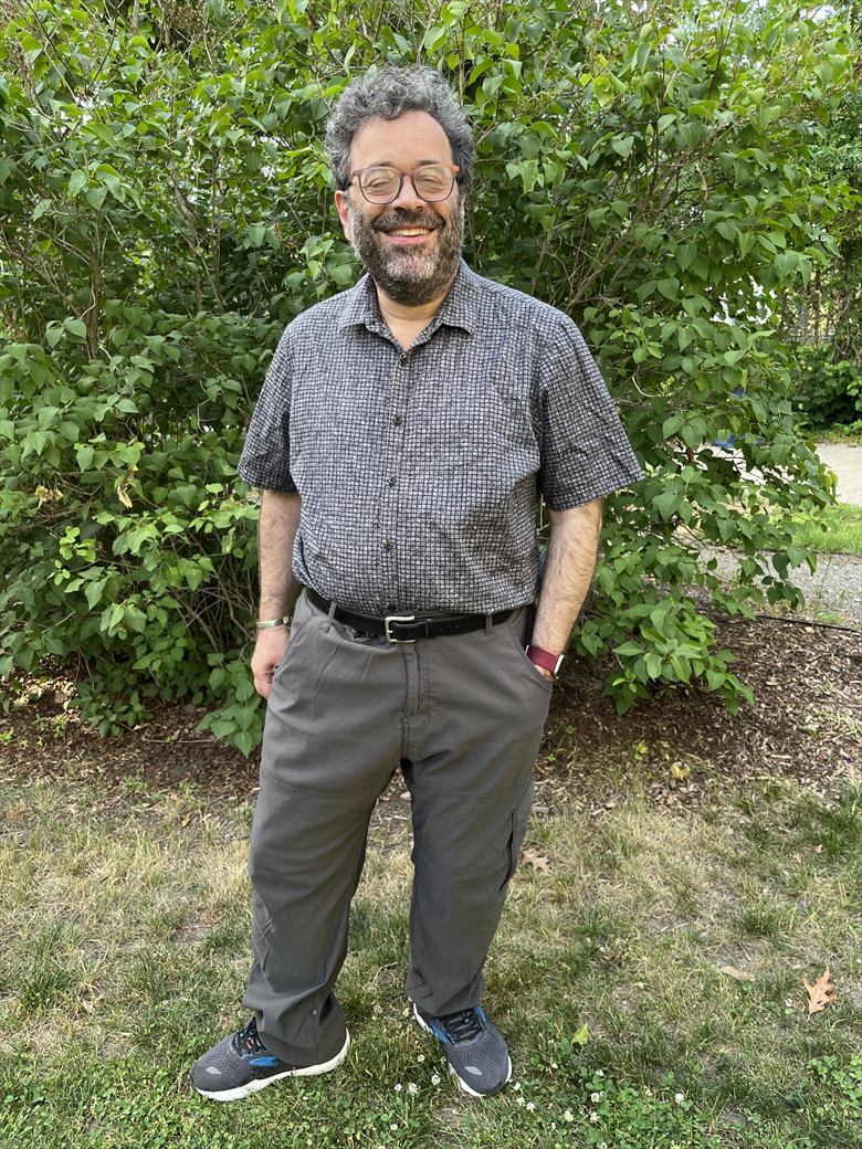 Avi Pfeffer standing in a garden