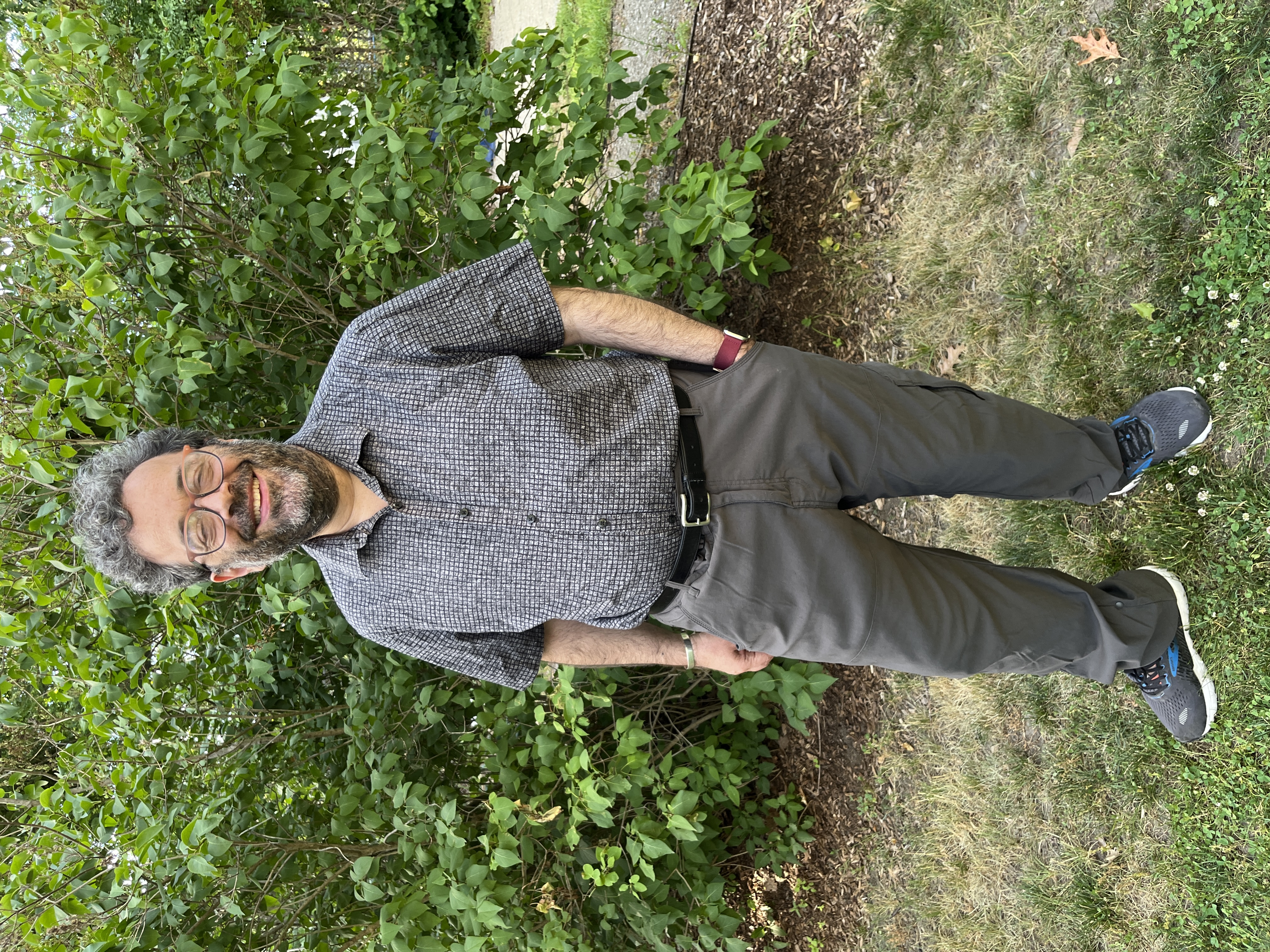 Avi Pfeffer standing in a garden